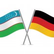 Flaggen von Usbekistan und Deutschland
